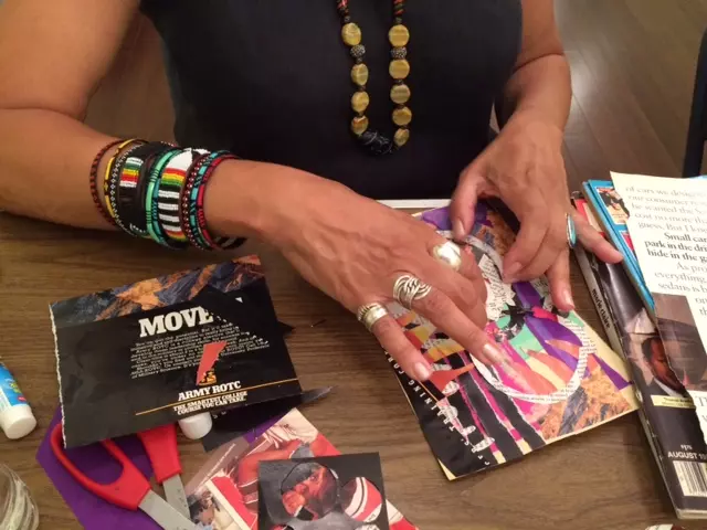 A woman is holding onto some magazines