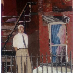 A man standing in front of stairs and a door.