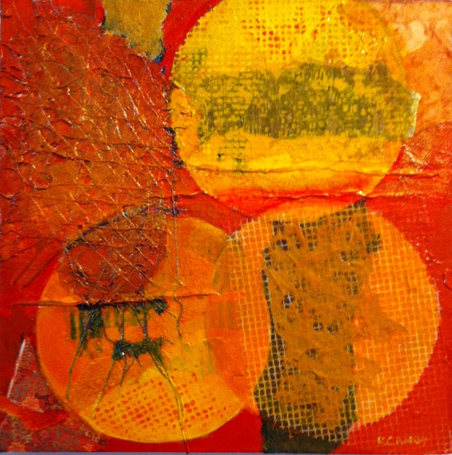 A painting of circles in orange and yellow.