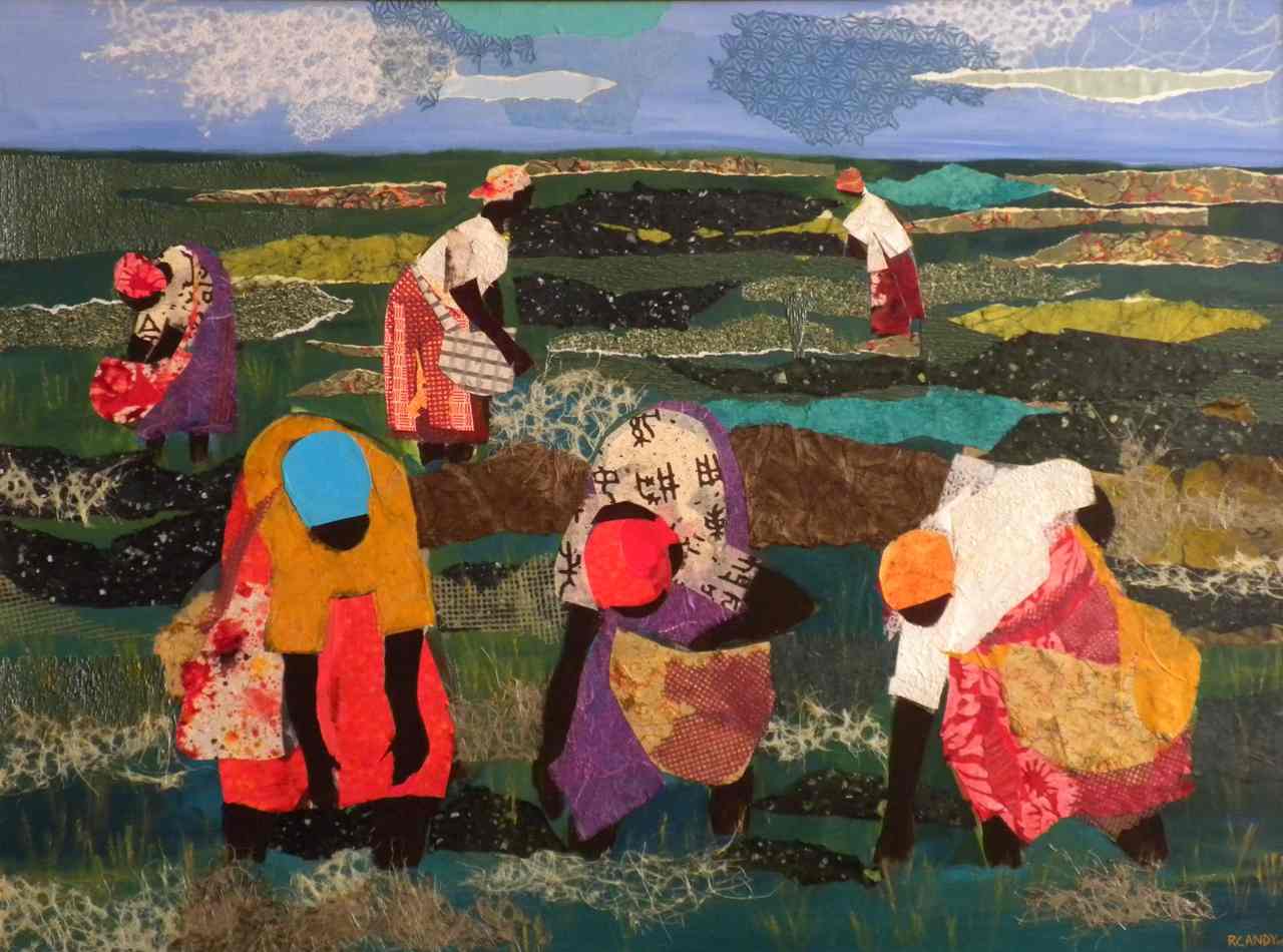 A group of people in the grass with baskets.