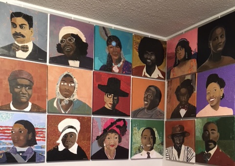A wall with many different paintings of people.